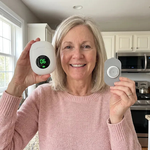 Angela holding her Ivalen control hub and pod